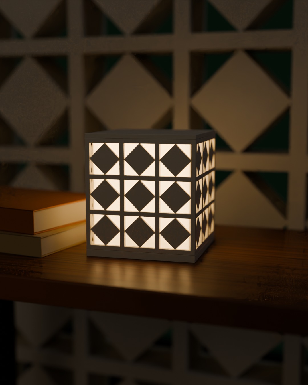 ANGIN cordless lamp in bone white, switched on, against a breeze-block wall