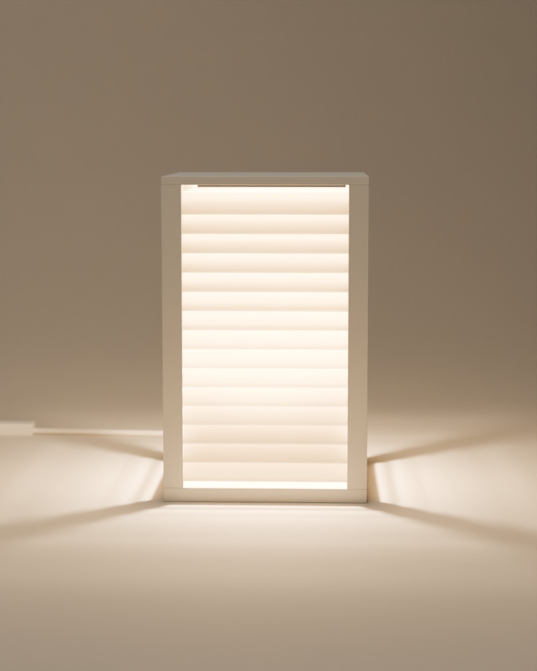 BIDAI table lamp in bone white, switched on, on a plain studio background