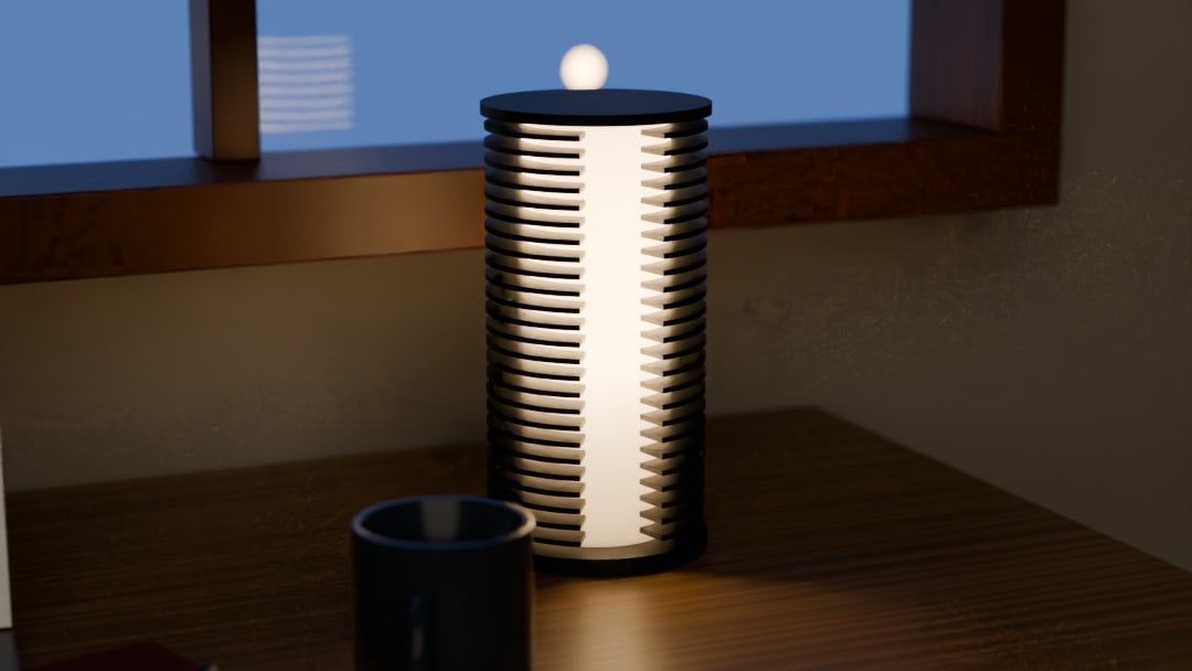 COLUMN table lamp in graphite, switched on, on an oak desk by a window at blue hour