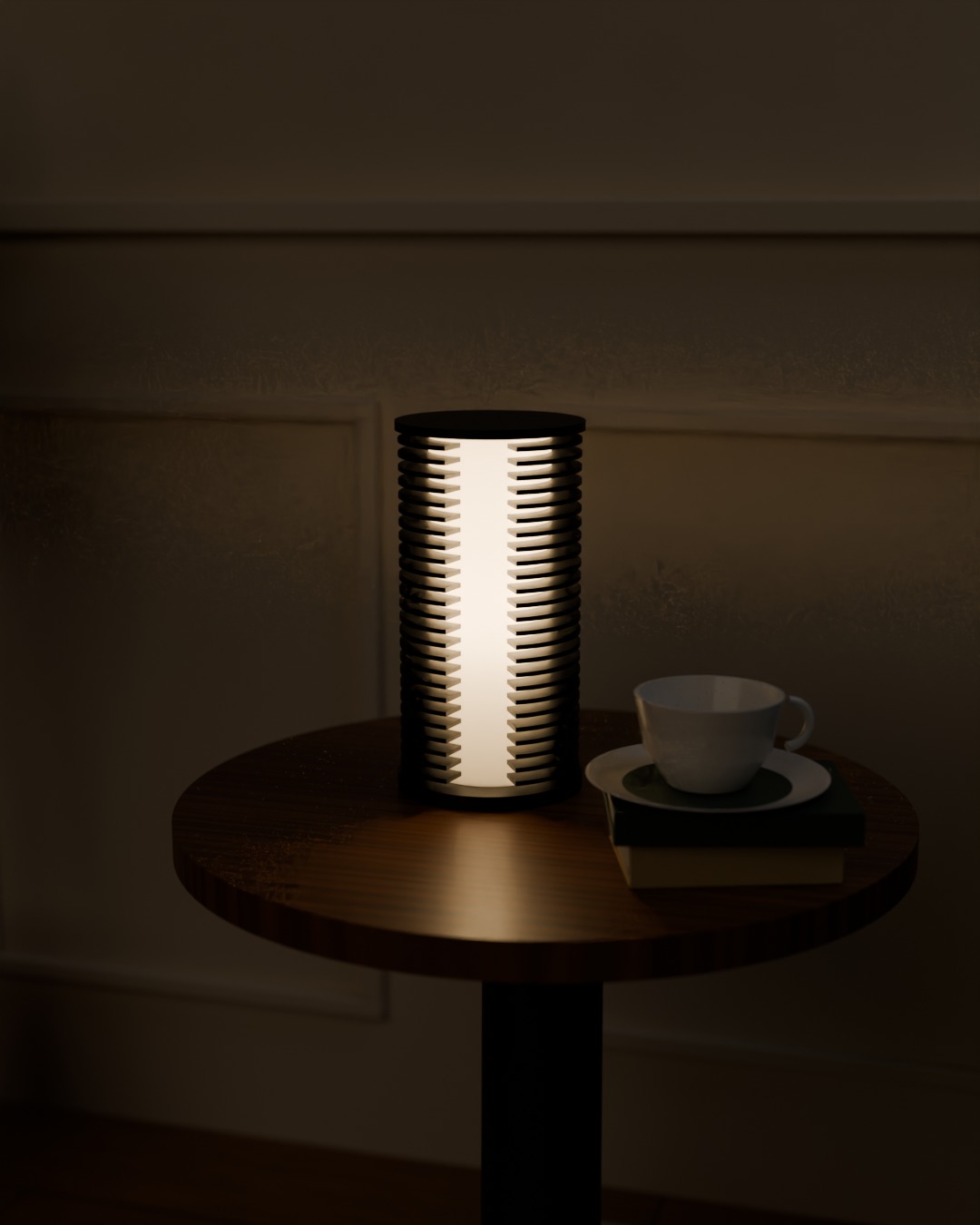 COLUMN table lamp in graphite, switched on, beside a sofa
