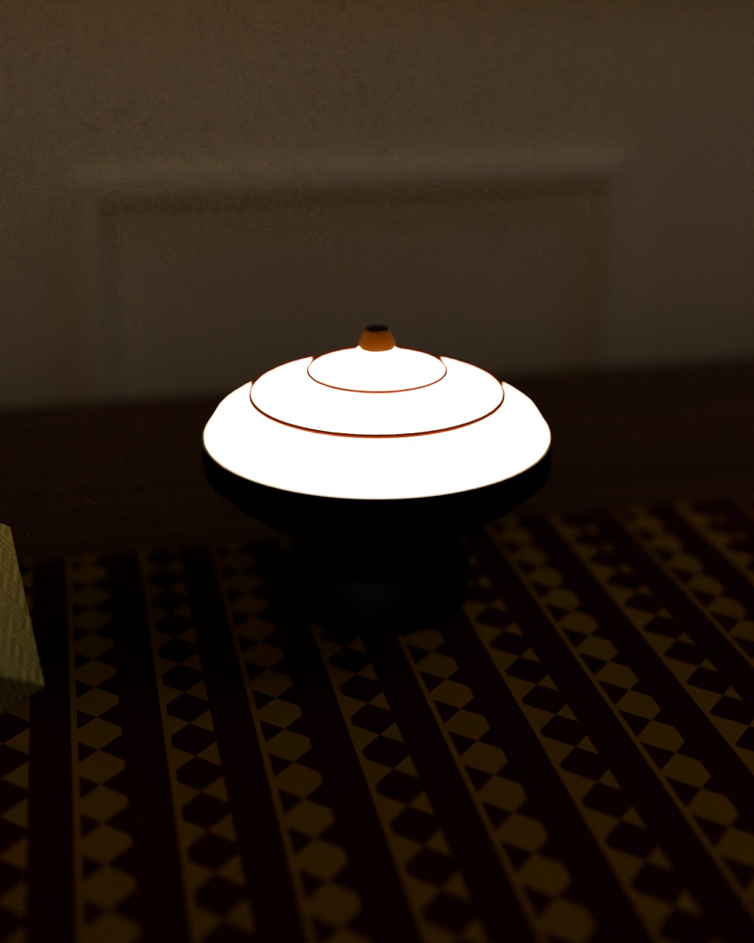 GASING cordless lamp in red, steel grey and wood, switched on, in a Hari Raya living room