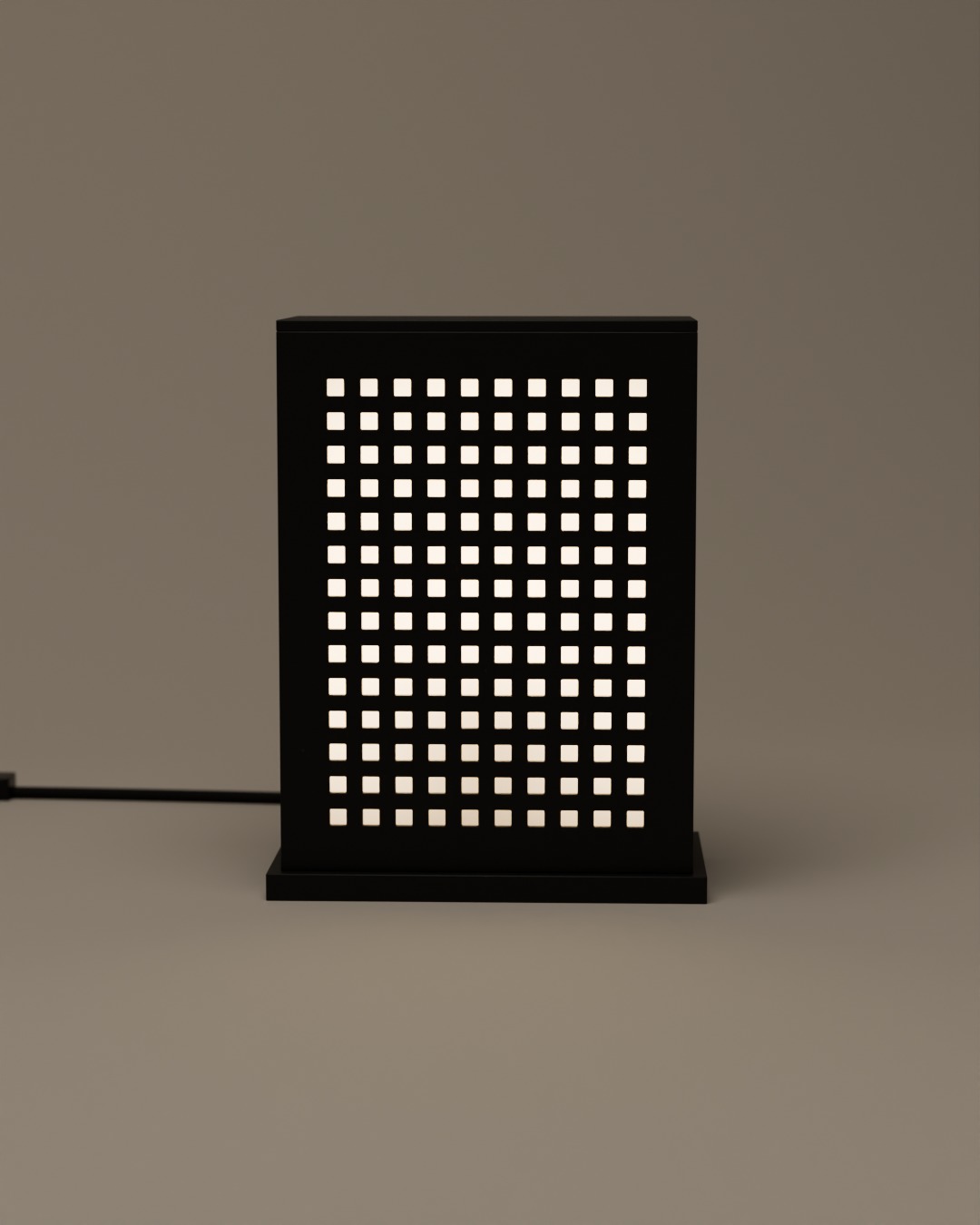 MATRIX table lamp in graphite, switched on, on a plain studio background