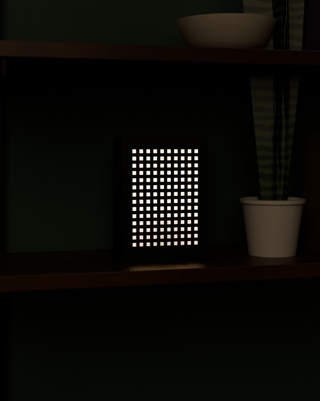 MATRIX table lamp in graphite, switched on, on a bookshelf