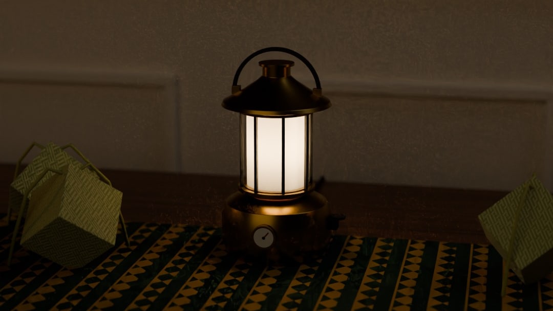 PAM table lamp in brass, switched on, on a Raya dining table with a songket runner at night