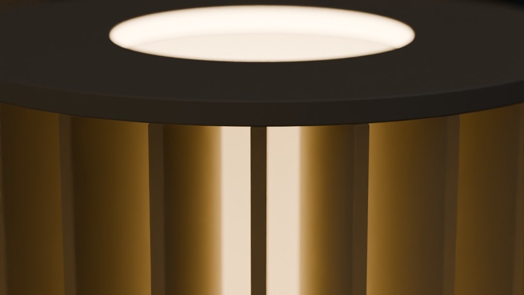 SIRIP table lamp in bone white, switched on, close-up of the lit top ring and glowing fins