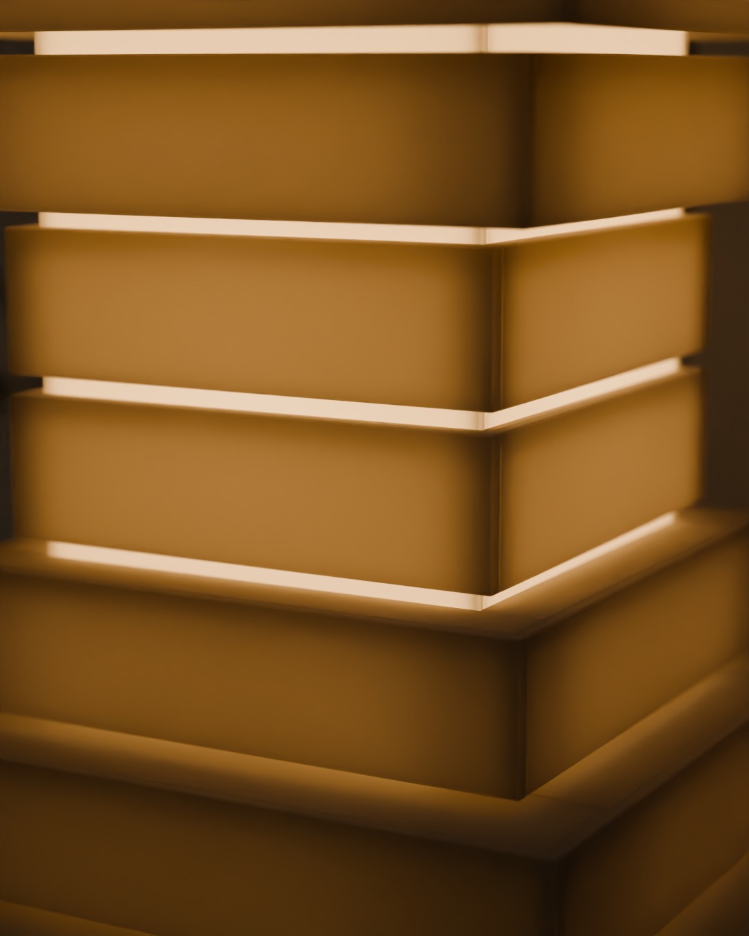 Close-up of the TINGKAT table lamp in bone white, switched on, against a breeze-block wall, the slot of light between tiers