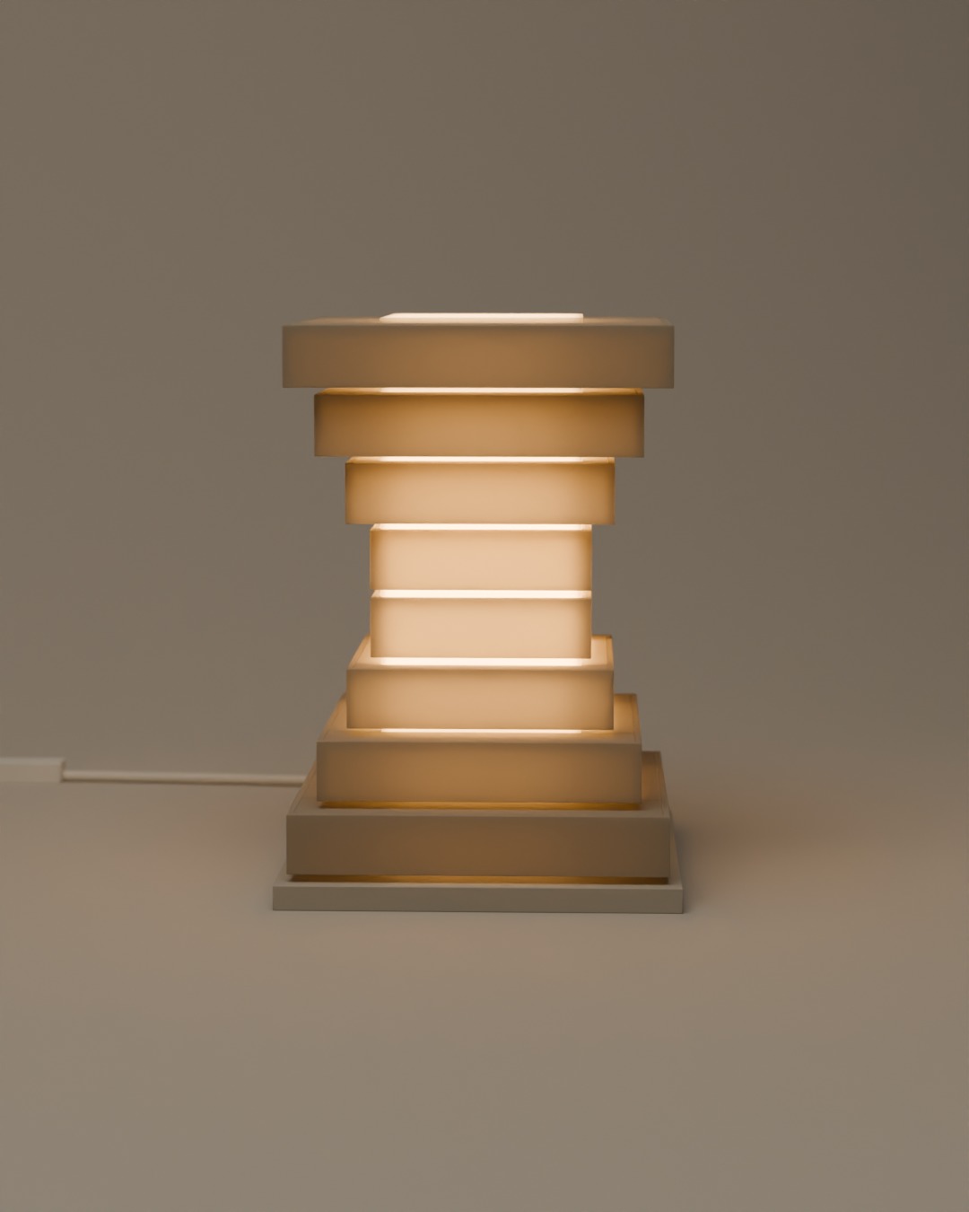 TINGKAT table lamp in bone white, switched on, on a plain studio background