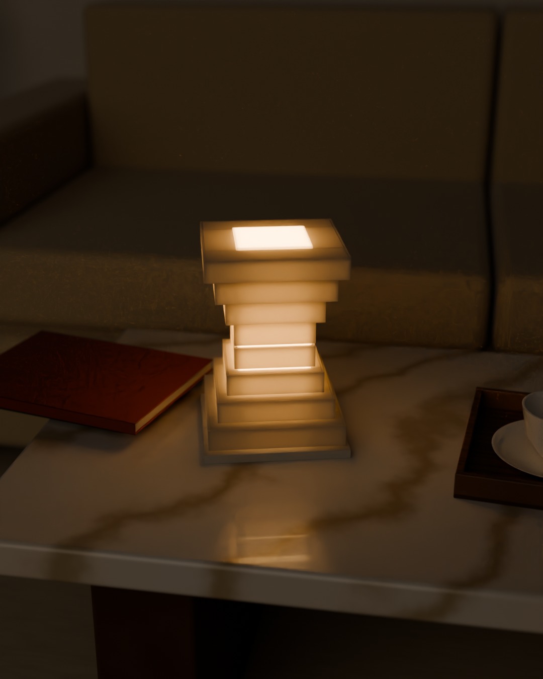 TINGKAT table lamp in bone white, switched on, on a coffee table