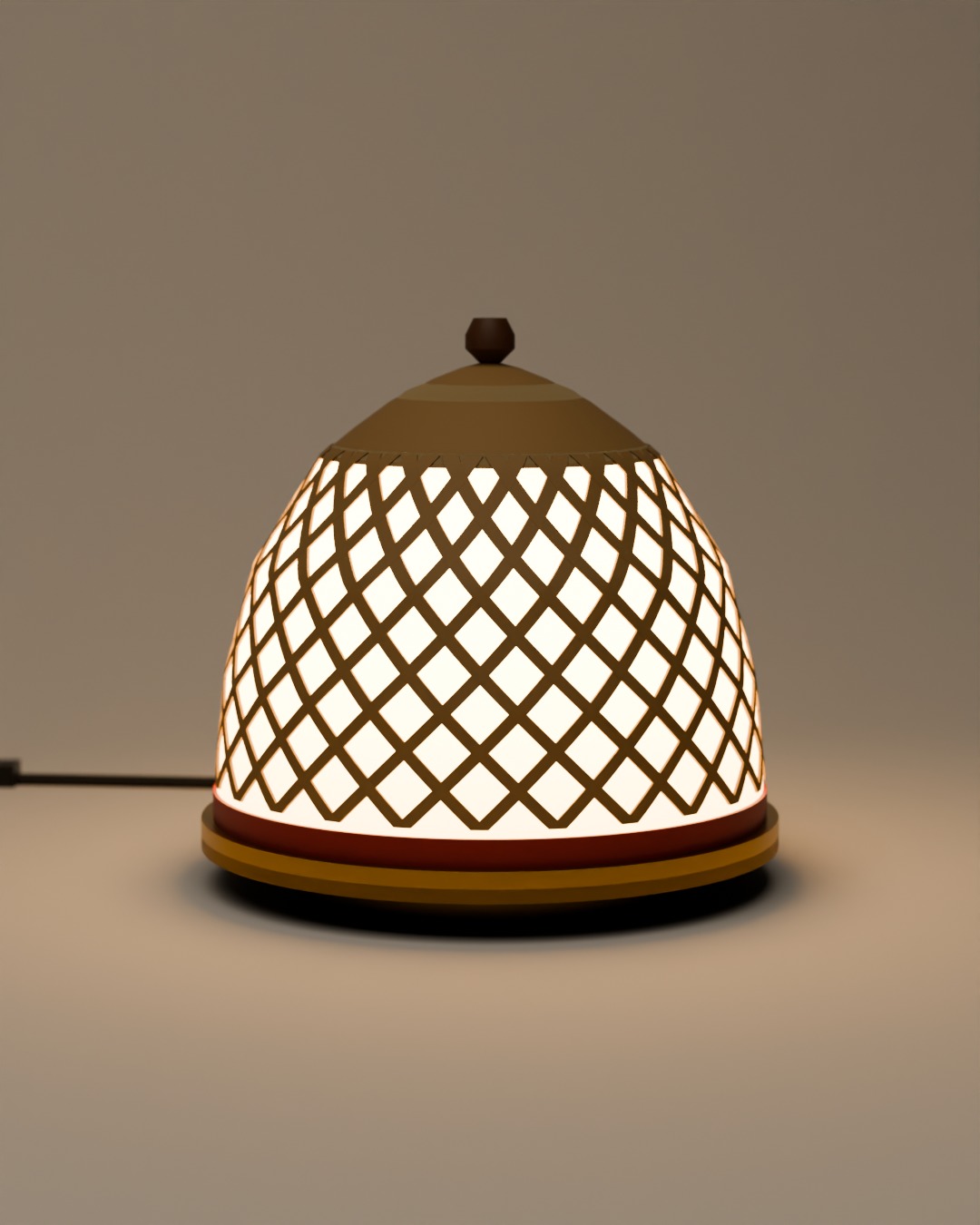 TUDUNG table lamp in bone, red and brass, switched on, on a plain studio background